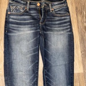 Buckle black skinny jeans